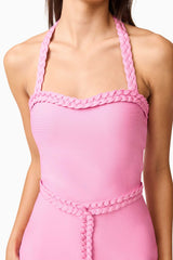 Brunette model wearing Coralene Halter Gown in Pink detail shot