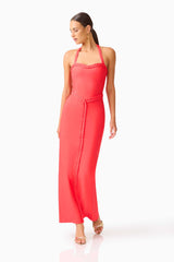 Brunette model wearing the Coralene Halter Gown in Red looking away shot