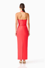 Brunette model wearing the Coralene Halter Gown in Red back shot