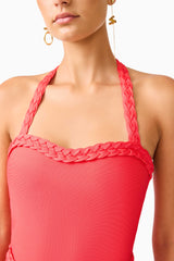 Brunette model wearing the Coralene Halter Gown in Red detail shot