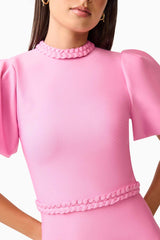 Brunette model wearing Coralene Puff Sleeve Midi Dress in Pink detail shot