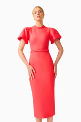 Blonde model wearing the Coralene Puff Sleeve Midi Dress in Red close up hands on hip shot