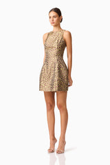 Brunette model wearing Elara Tulip Mini Dress in Leopard Print side shot
