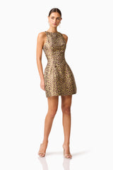 Brunette model wearing Elara Tulip Mini Dress in Leopard Print posed shot