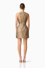 Brunette model wearing Elara Tulip Mini Dress in Leopard Print back shot