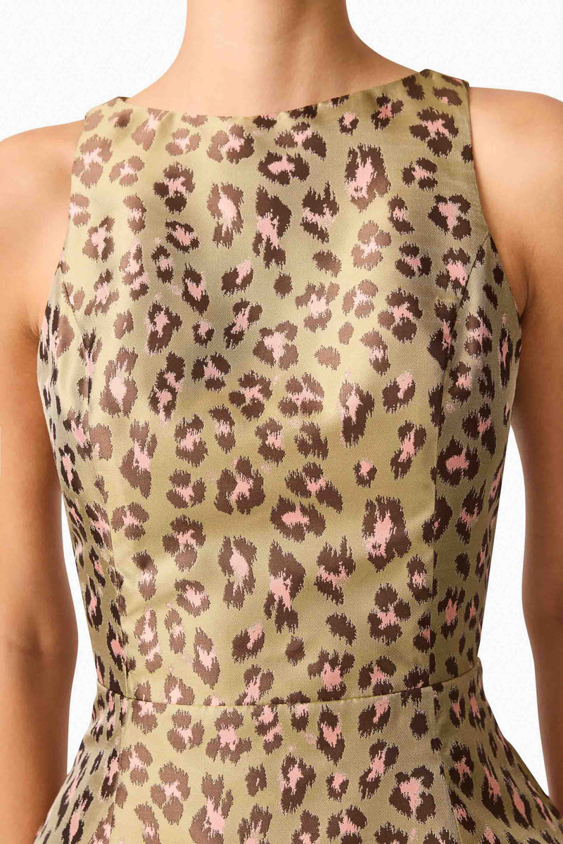 Brunette model wearing Elara Tulip Mini Dress in Leopard Print detailed shot