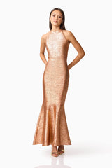 Brunette Model wearing the Rhian Halter Gown in Orange Posed Shot