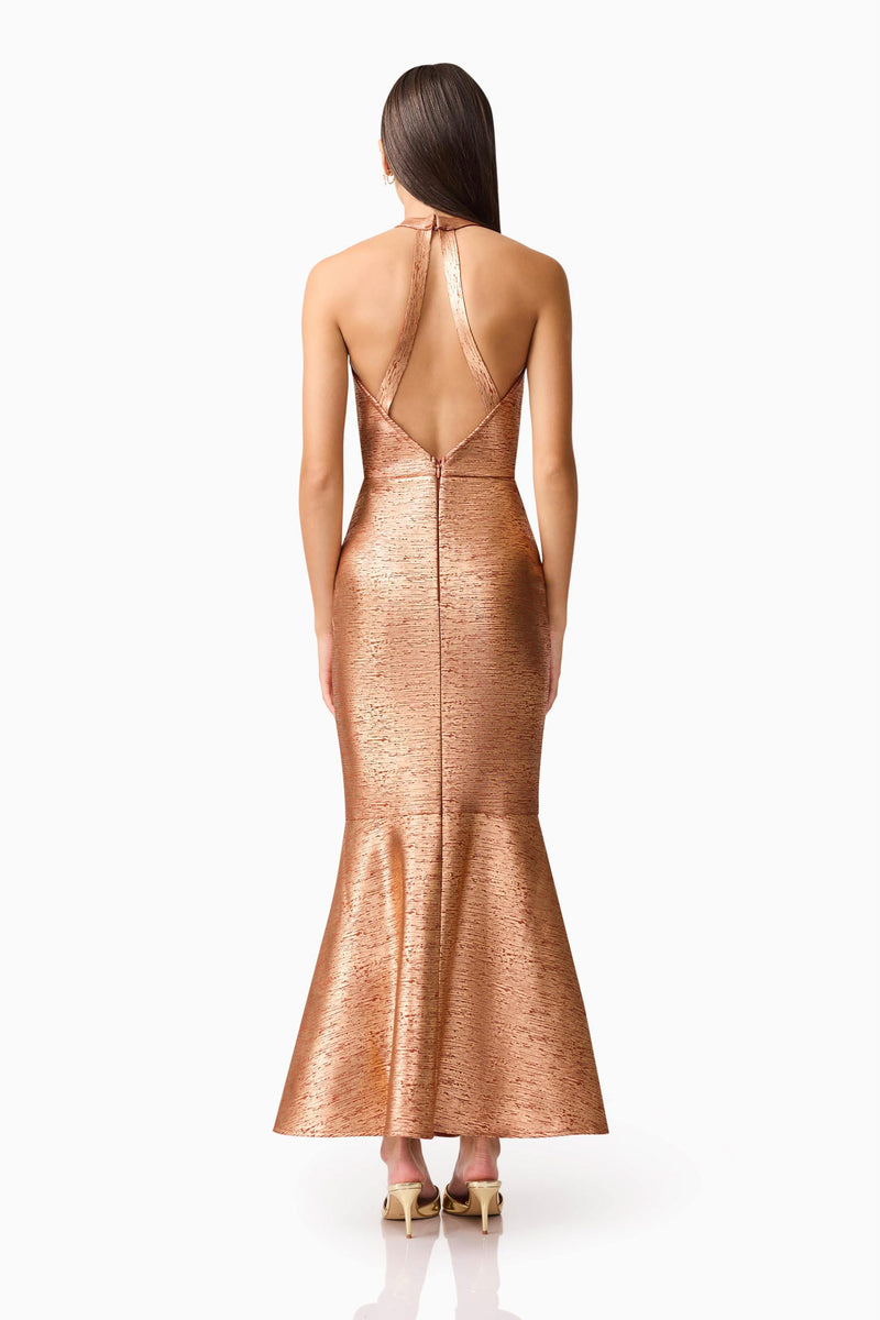 Brunette Model wearing the Rhian Halter Gown in Orange Back Shot