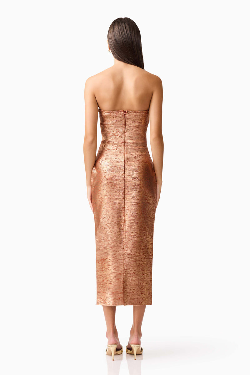 Brunette model wearing the Rhian Strapless Midi Dress in Orange Back Shot