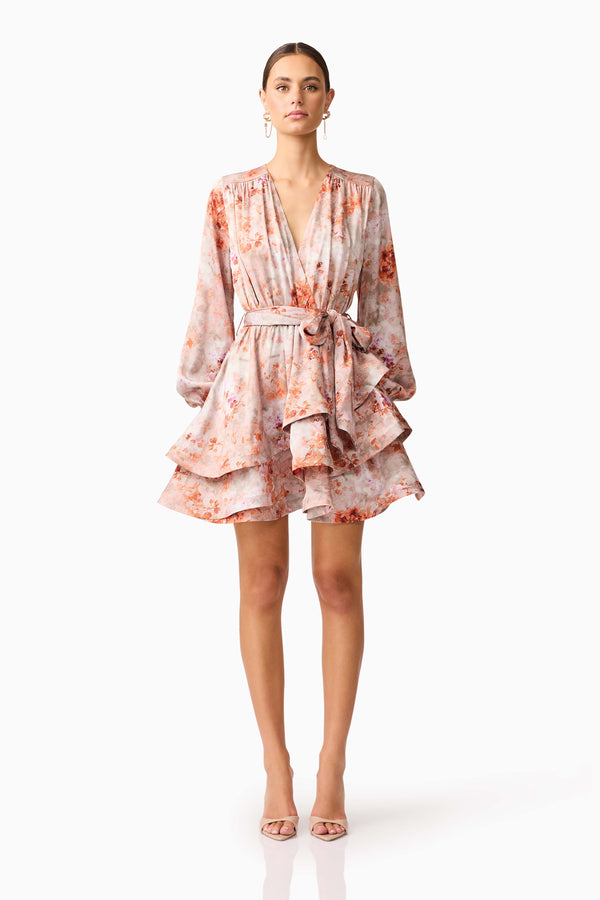 Brunette model wearing the Piper Long Sleeve Mini Dress in Orange Floral Front Shot