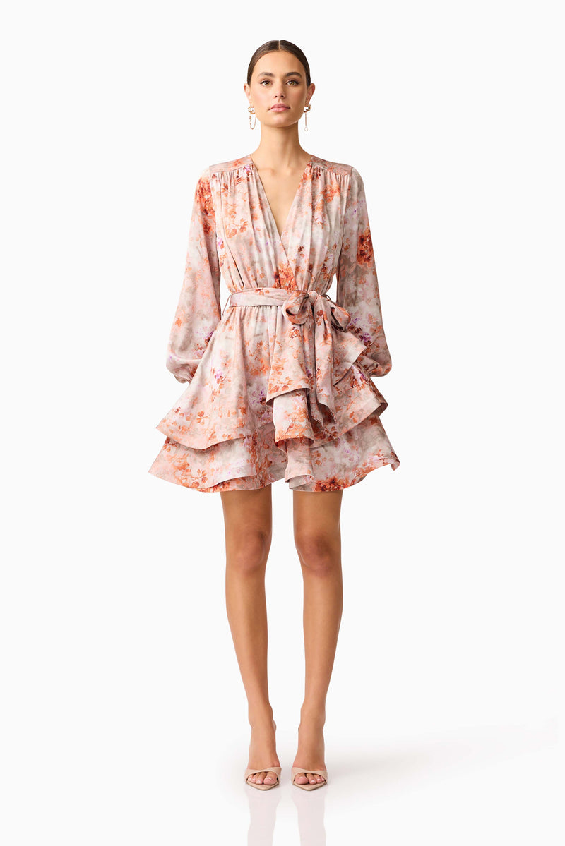 Brunette model wearing the Piper Long Sleeve Mini Dress in Orange Floral Front Shot