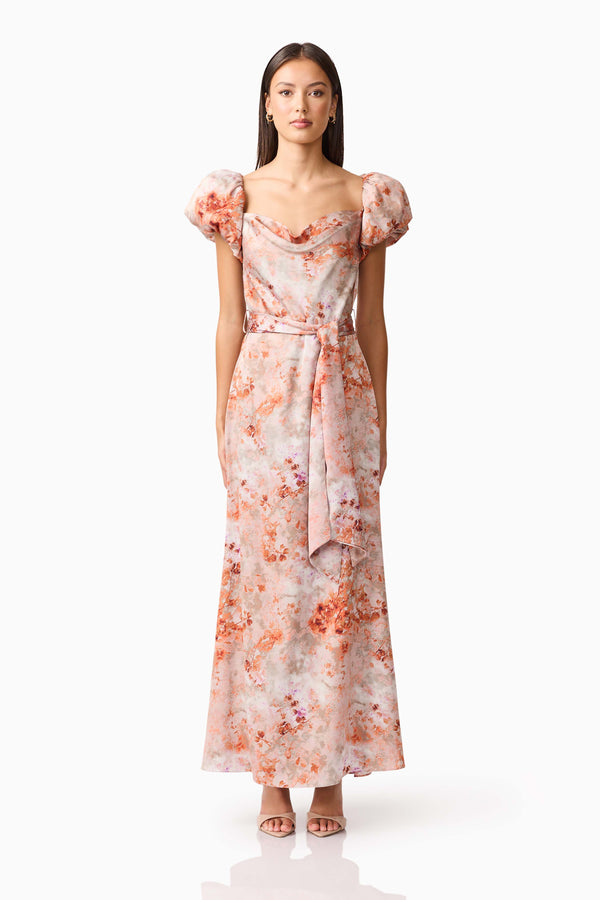 Brunette model wearing the Piper Puff Sleeve Maxi Dress in Orange Floral Front Shot