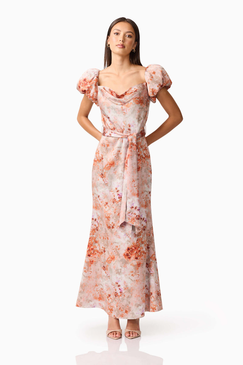 Brunette model wearing the Piper Puff Sleeve Maxi Dress in Orange Floral Posed Shot