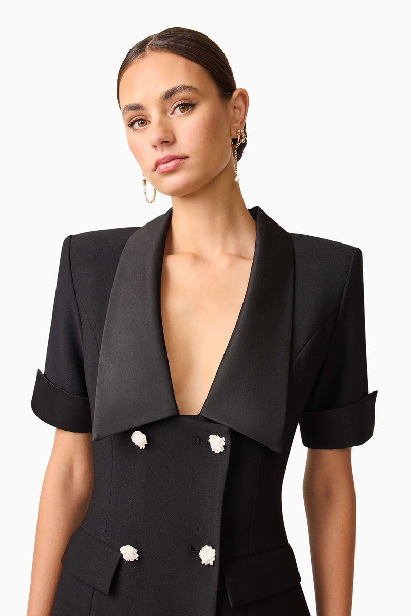 Brunette model wearing Ruby Short Sleeve Blazer Dress in Black detail shot