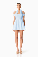 Brunette model wearing Ruby Halter Mini Dress in Blue front shot 