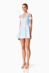 Brunette model wearing Ruby Halter Mini Dress in Blue side shot 