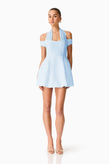 Brunette model wearing Ruby Halter Mini Dress in Blue posed shot 