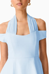 Brunette model wearing Ruby Halter Mini Dress in Blue detail shot 