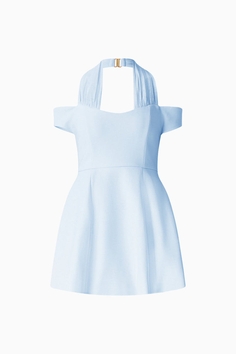 Brunette model wearing Ruby Halter Mini Dress in Blue ghost shot 