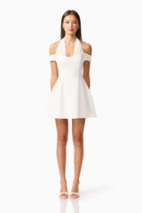 Brunette model wearing Ruby Halter Mini Dress in White front Shot