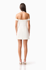 Brunette model wearing Ruby Halter Mini Dress in White back Shot