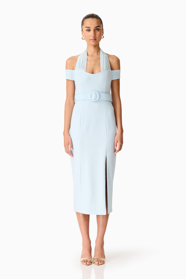Brunette model wearing the Ruby Halter Midi Dress in Blue front shot