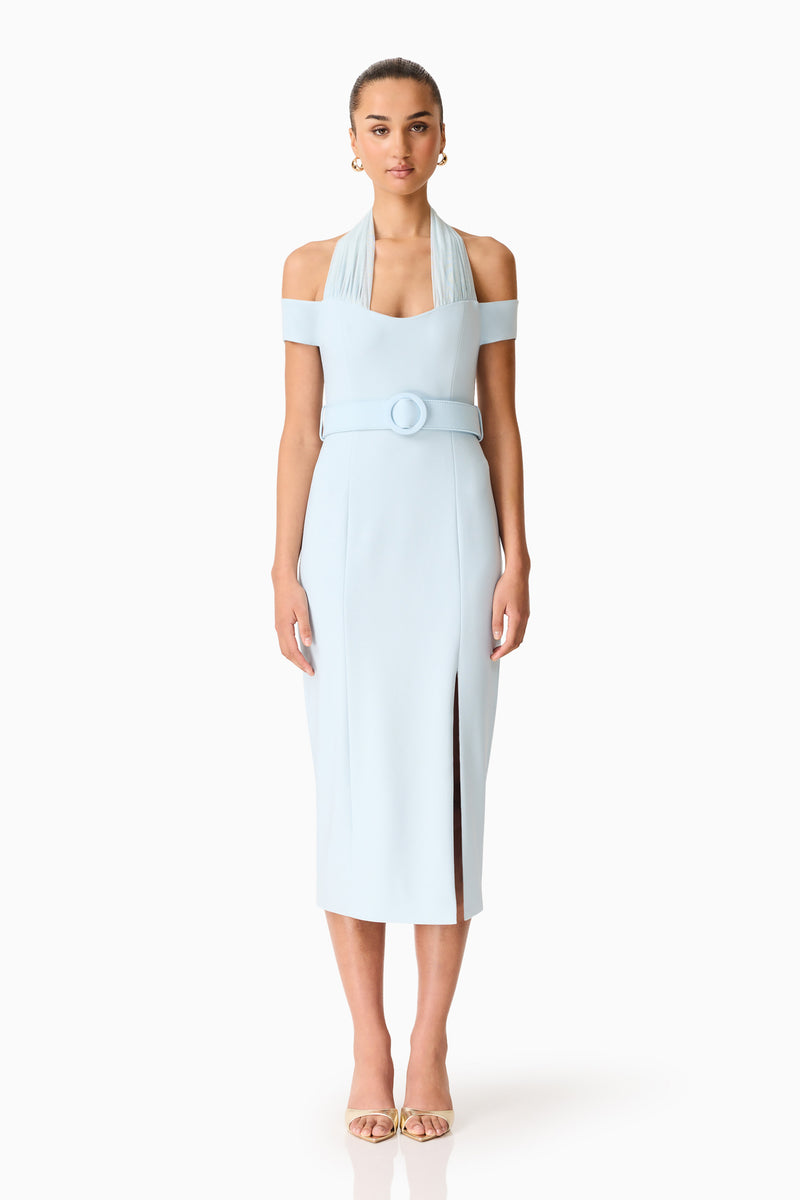 Brunette model wearing the Ruby Halter Midi Dress in Blue front shot