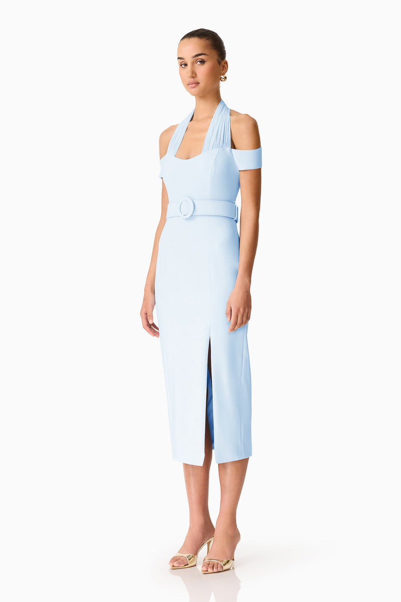 Brunette model wearing the Ruby Halter Midi Dress in Blue side shot