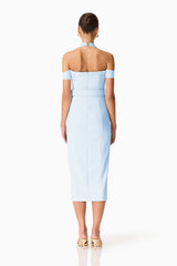 Brunette model wearing the Ruby Halter Midi Dress in Blue back shot