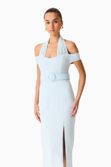 Brunette model wearing the Ruby Halter Midi Dress in Blue close up hand on hip shot