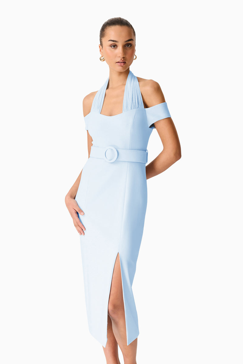 Brunette model wearing the Ruby Halter Midi Dress in Blue posed shot