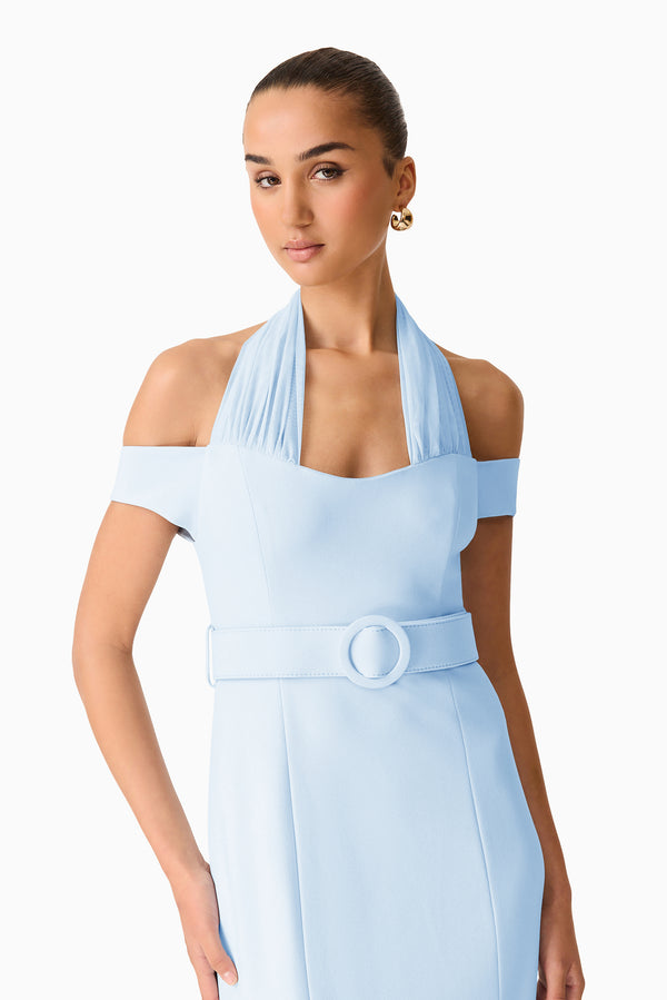 Brunette model wearing the Ruby Halter Midi Dress in Blue close up shot