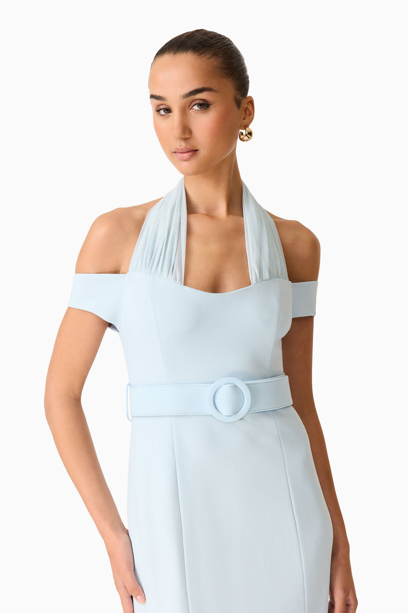 Brunette model wearing the Ruby Halter Midi Dress in Blue close up shot