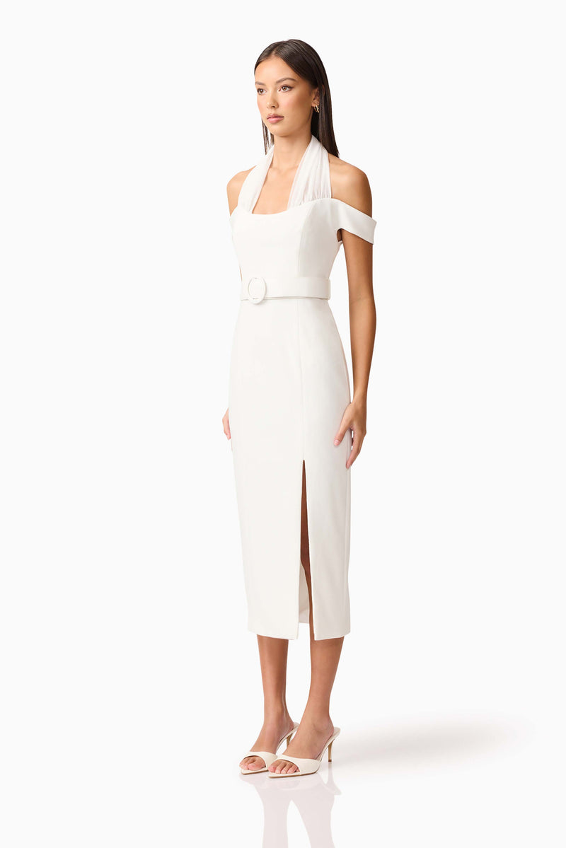 Brunette model wearing the Ruby Halter Midi Dress in White side Shot