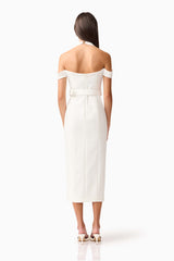 Brunette model wearing the Ruby Halter Midi Dress in White Back Shot
