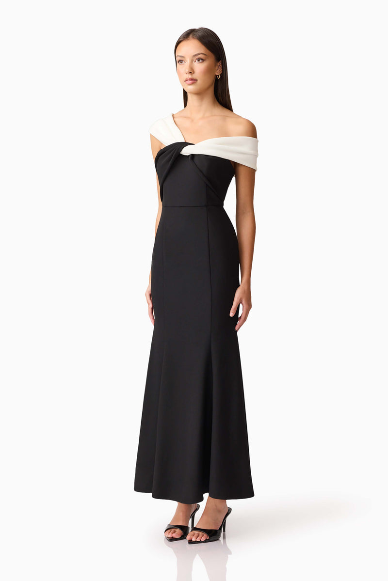Brunette model wearing Ruby Off The Shoulder Gown in Black side shot