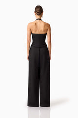 Brunette model wearing Ruby Halter Top in Black back shot