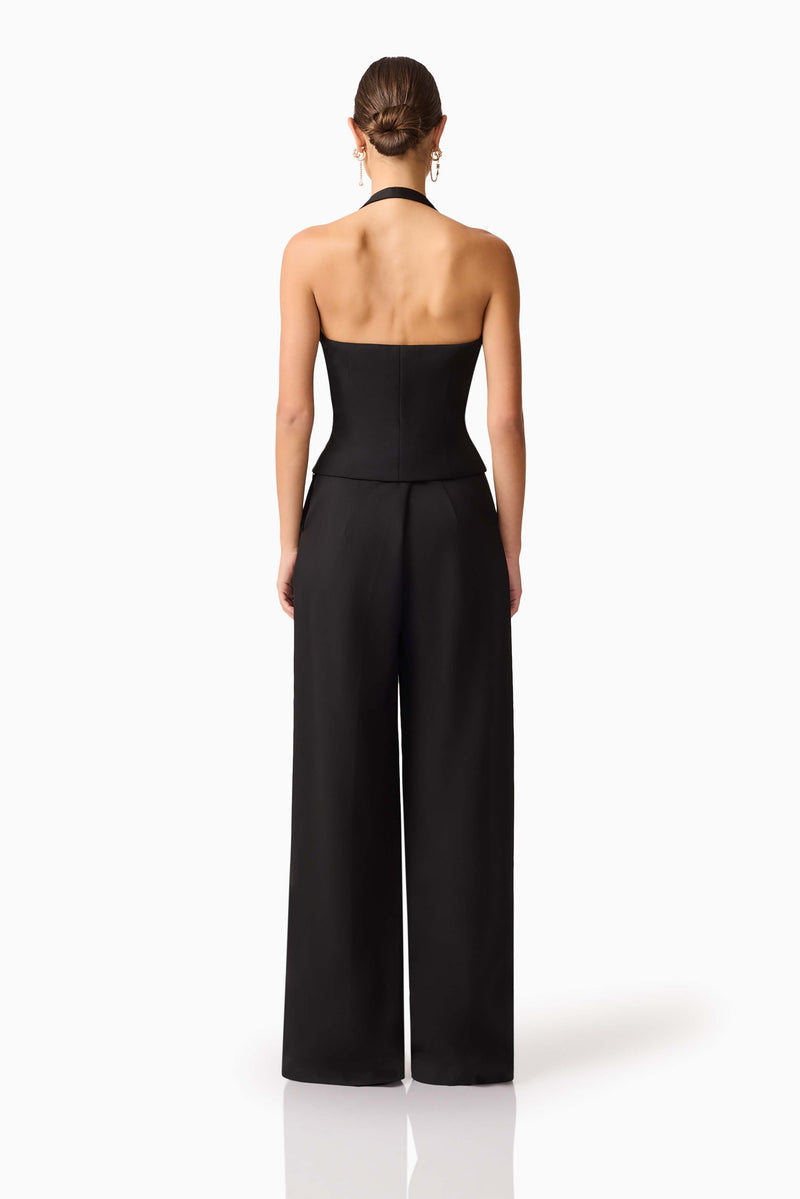 Brunette model wearing Ruby Halter Top in Black back shot