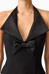 Brunette model wearing Ruby Halter Top in Black detail shot