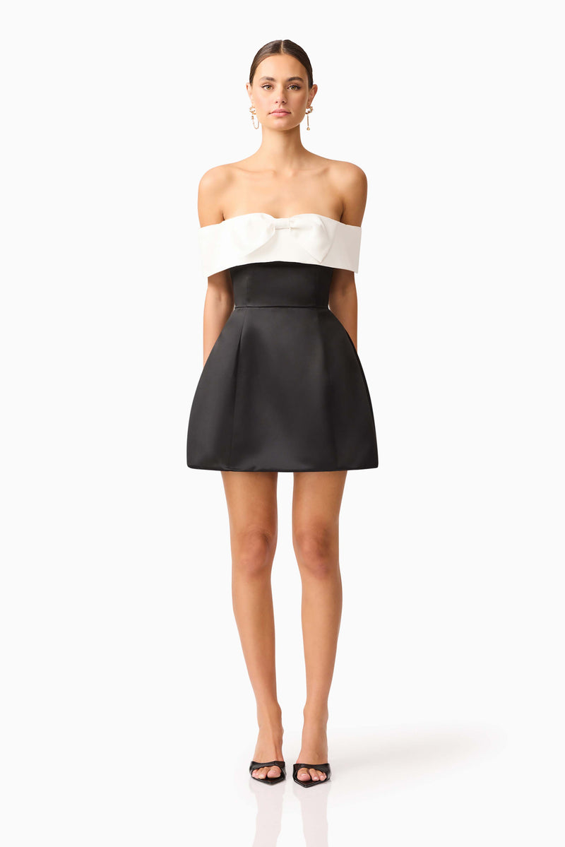 Brunette model wearing Sorrel Off the Shoulder Mini Dress in Black & White posed shot