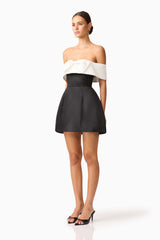 Brunette model wearing Sorrel Off the Shoulder Mini Dress in Black & White side shot