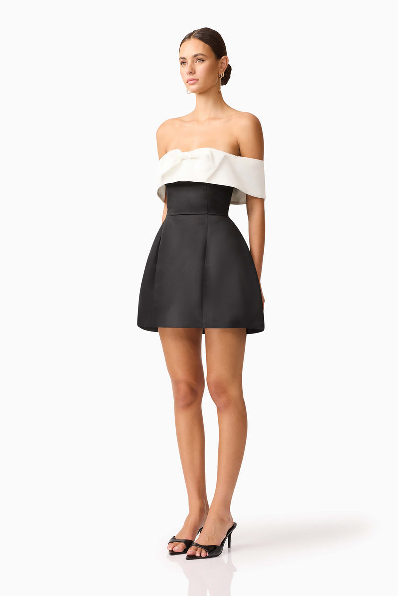 Brunette model wearing Sorrel Off the Shoulder Mini Dress in Black & White side shot