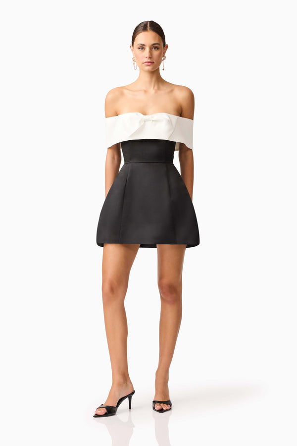 Brunette model wearing Sorrel Off the Shoulder Mini Dress in Black & White front shot