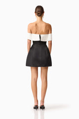 Brunette model wearing Sorrel Off the Shoulder Mini Dress in Black & White back shot