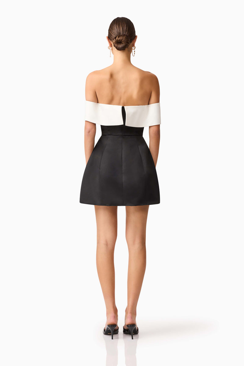 Brunette model wearing Sorrel Off the Shoulder Mini Dress in Black & White back shot