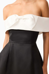Brunette model wearing Sorrel Off the Shoulder Mini Dress in Black & White detail shot