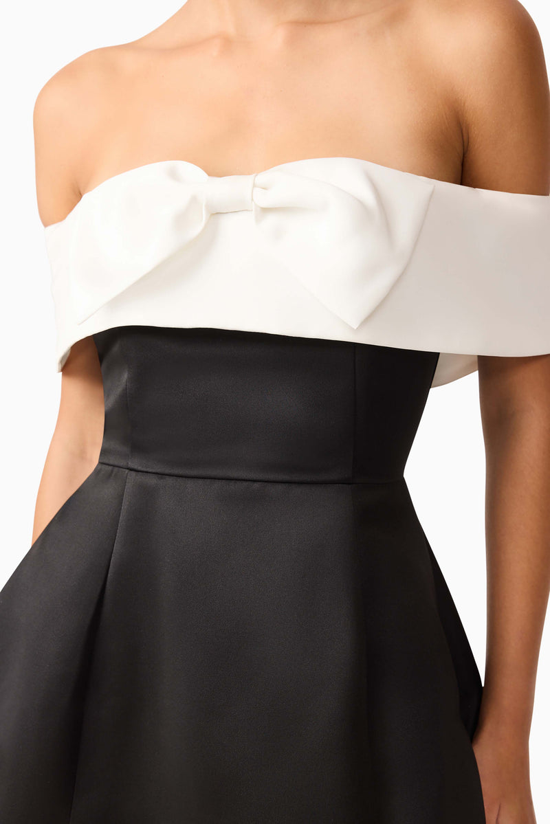 Brunette model wearing Sorrel Off the Shoulder Mini Dress in Black & White detail shot