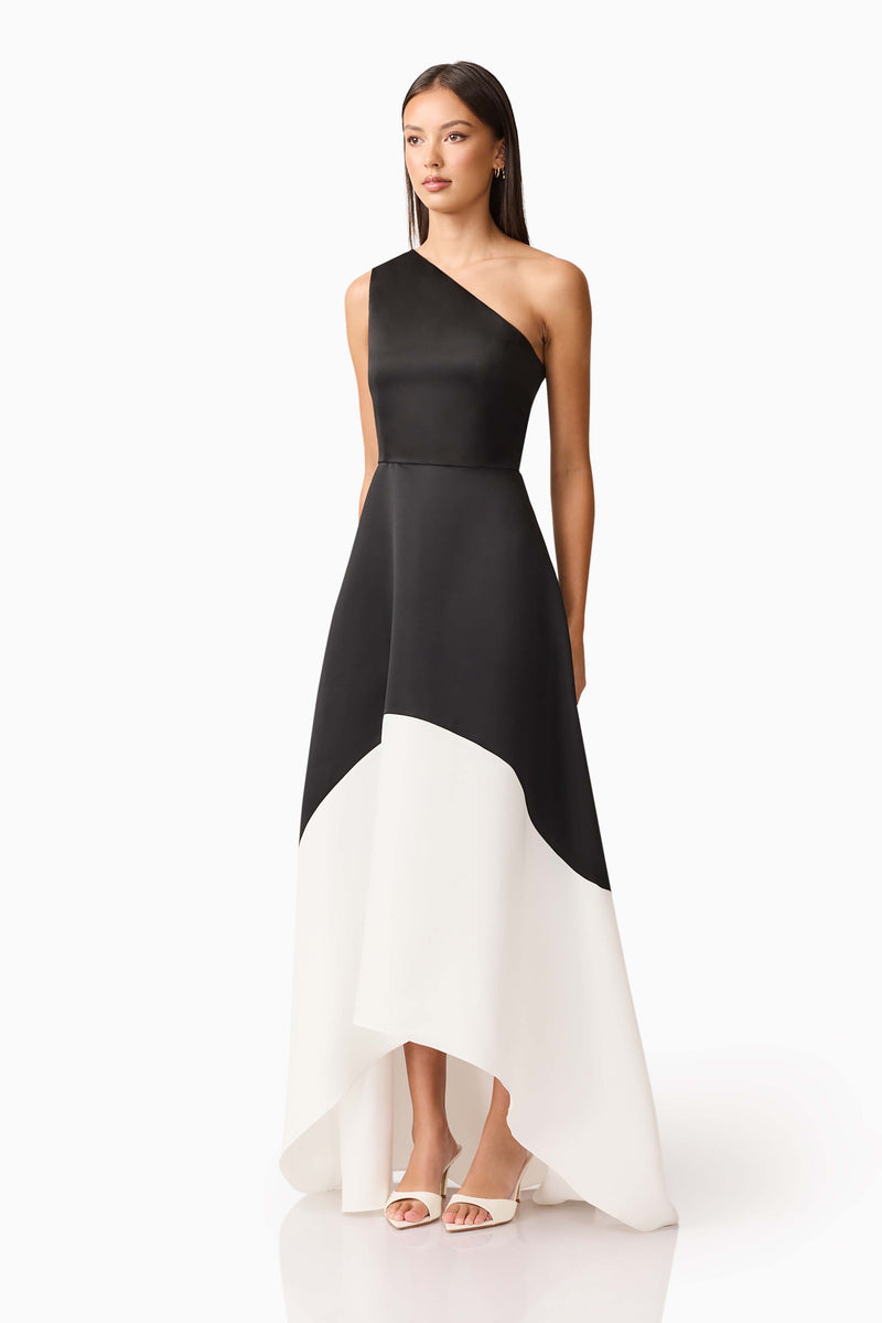 Brunette model wearing Sorrel One Shoulder Gown in Black & White side shot
