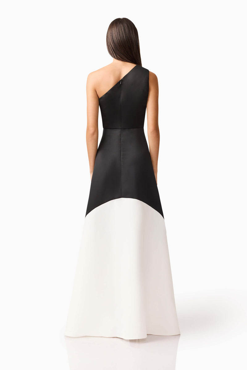Brunette model wearing Sorrel One Shoulder Gown in Black & White back shot
