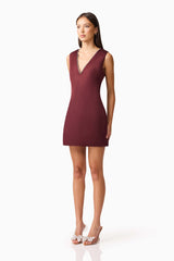 Brunette model wearing Livia Shift Mini Dress in Red side shot